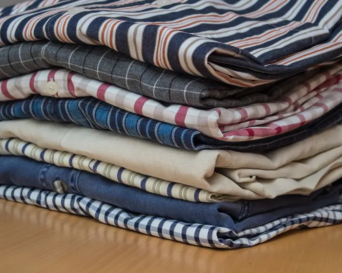 A neat stack of washed and ironed shirts
