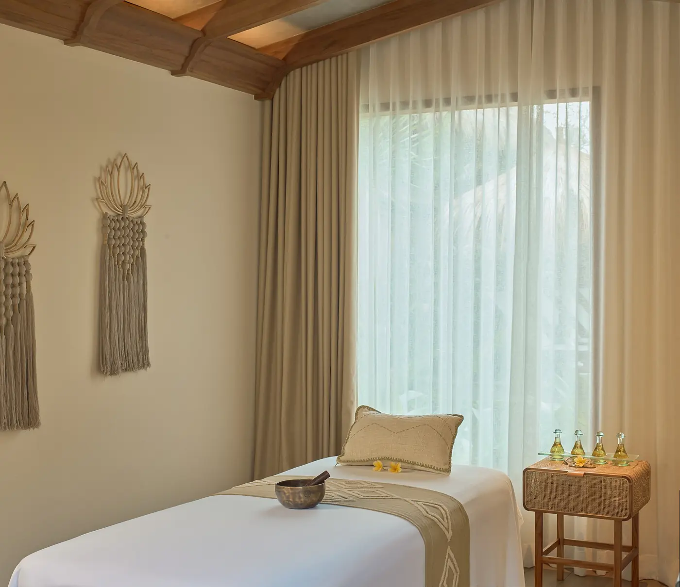 A calm spa treatment room with folded towels