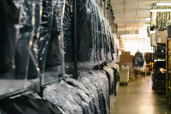 Dry-cleaned clothes on hangers